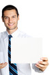 Happy businessman showing signboard, isolated