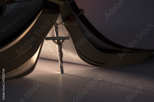 Photo: Crucifix propping open the bible Crucifix propping open the bible