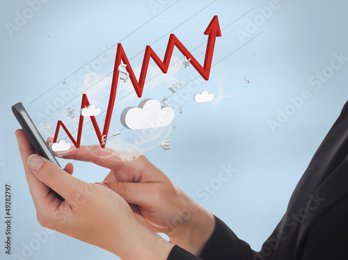 Photo: Businesswoman using her mobile phone Businesswoman using her mobile phone