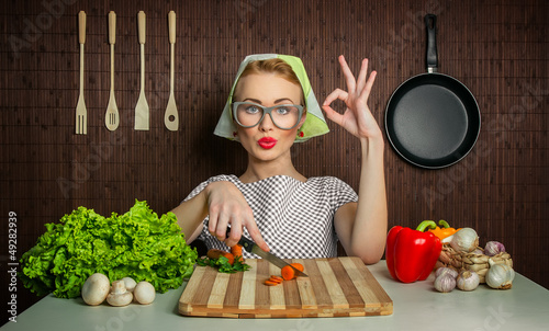 Photo: Happy woman cook with okay sign Happy woman cook with okay sign