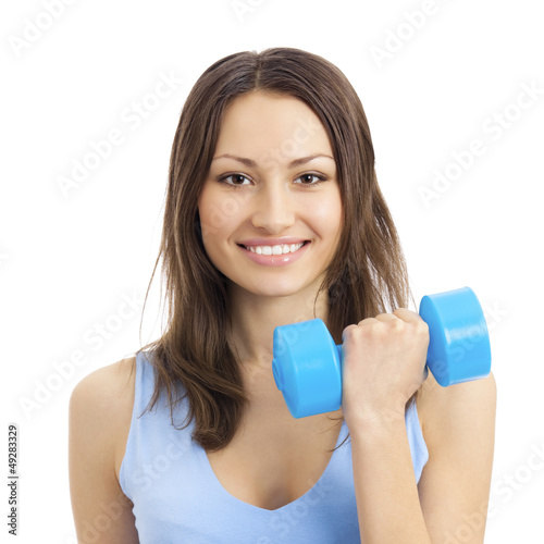Photo: Young woman exercising with dumbbell, isolated Young woman exercising with dumbbell, isolated