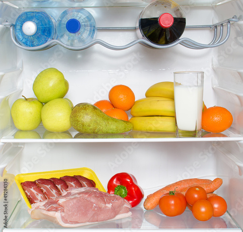 Photo: Open fridge full of fruits, vegetables and meat Open fridge full of fruits, vegetables and meat