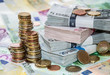 Stackes Coins and Euro Bills