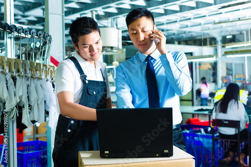 Photo: Worker and customer service of a factory Worker and customer service of a factory