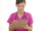 Nurse or young doctor woman in scrubs