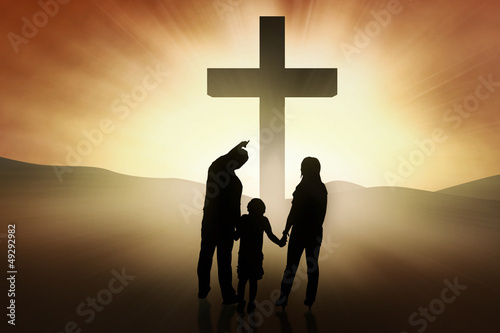 Illustration: Christian family standing at the Cross Christian family standing at the Cross