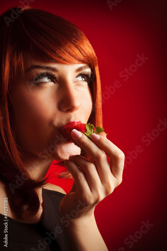 Photo: Sexy lady bite strawberry Sexy lady bite strawberry
