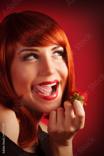 Photo: Girl holding strawberry Girl holding strawberry