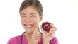 Medical doctor nurse woman showing and eating apple