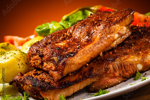Photo: Tasty grilled ribs with vegetables Tasty grilled ribs with vegetables