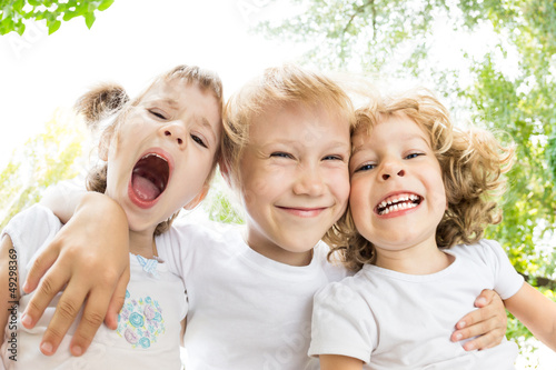 Photo: Low angle view portrait of funny children Low angle view portrait of funny children