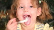 The girl is eating a cake