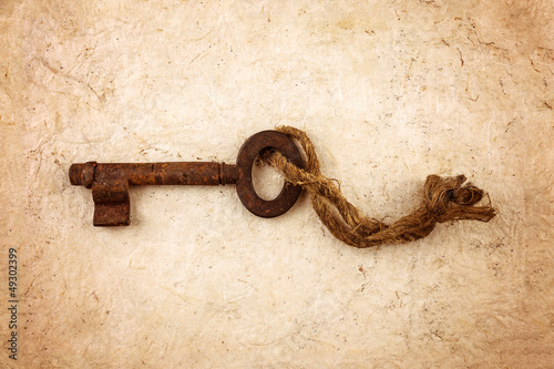 Photo: Antique key with small rope Antique key with small rope