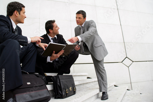 Photo: Male businessmen on steps Male businessmen on steps