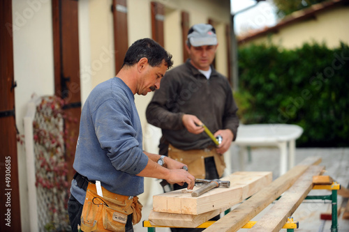 Photo: Two carpenters working on the same job Two carpenters working on the same job