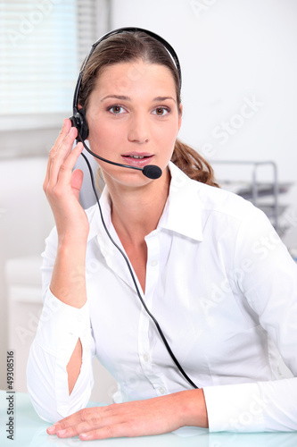 Photo: Young brunette telephonist Young brunette telephonist