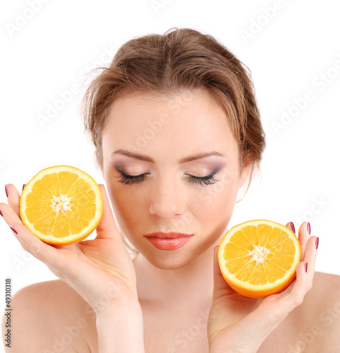 Photo: Beautiful young woman with bright make-up, holding orange, Beautiful young woman with bright make-up, holding orange,
