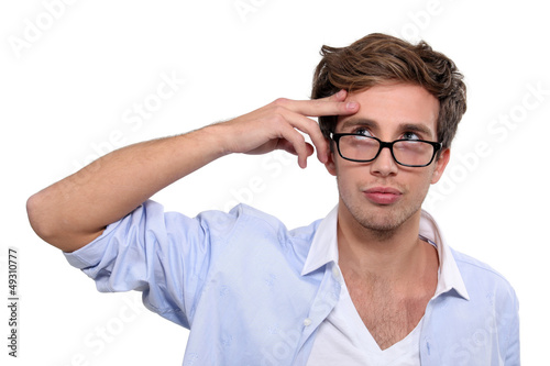 Photo: young man trying to remember young man trying to remember