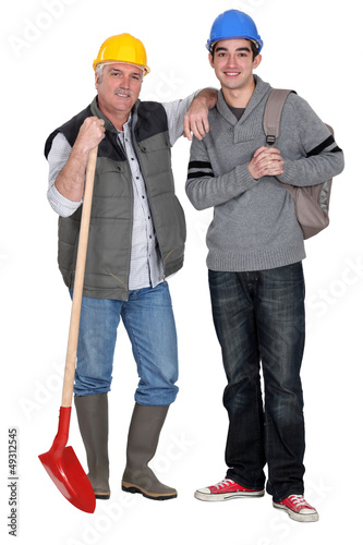 Photo: Experienced tradesman welcoming his new apprentice Experienced tradesman welcoming his new apprentice