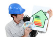 craftsman holding an energy consumption label