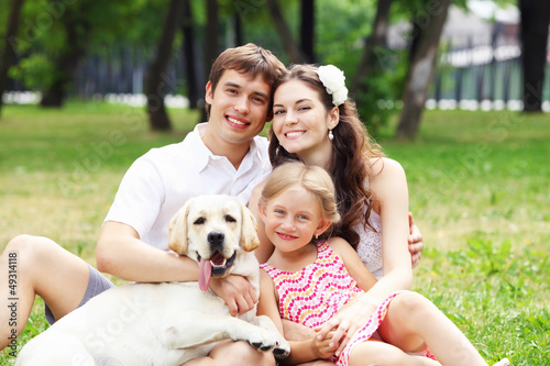 Photo: Happy family having fun outdoors Happy family having fun outdoors