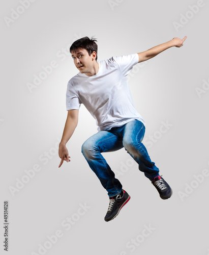 Photo: Young man dancing and jumping Young man dancing and jumping