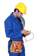 electrician holding a measurement tool