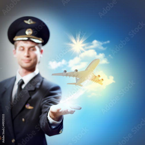 Photo: Image of pilot with plane in hand Image of pilot with plane in hand