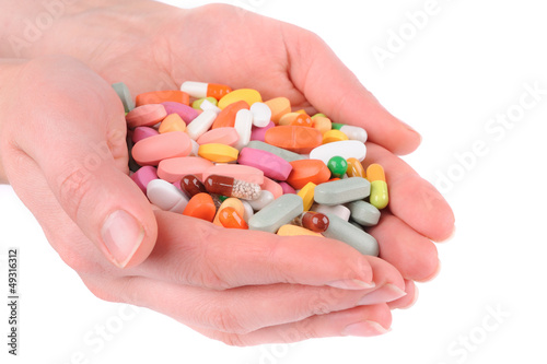 Photo: Hand with a pills on white background Hand with a pills on white background