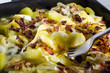 Dish of Tartiflette with fork