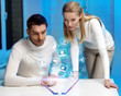 man and woman working with virtual screen