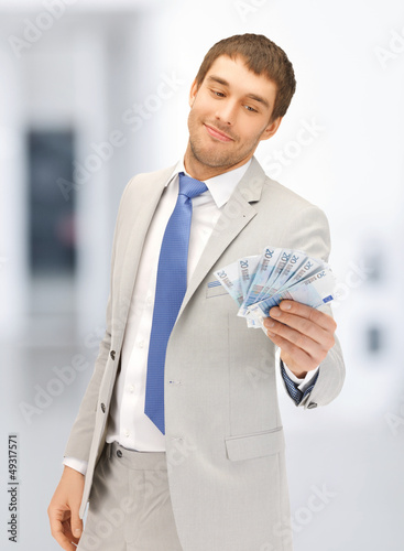 Photo: man with euro cash money man with euro cash money