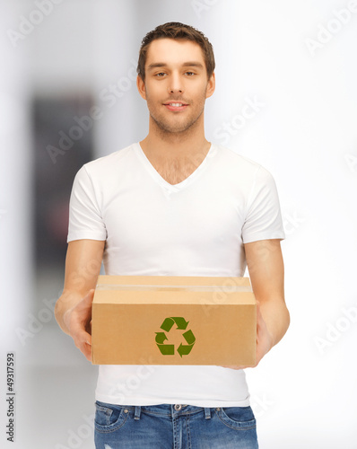 Photo: handsome man with recyclable box handsome man with recyclable box