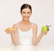 woman with hamburger and apple