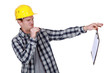 Construction worker holding a distasteful clipboard