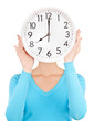 woman holding big clock