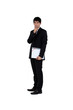 young businessman with finger to his mouth isolated on white