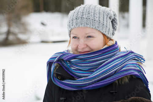 Photo: Wrapped in scarf woman looking at distance Wrapped in scarf woman looking at distance