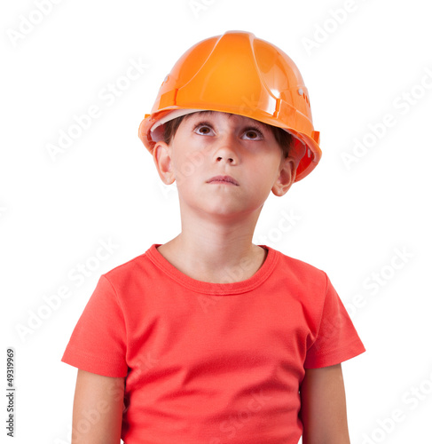 Photo: Girl in an orange helmet looking up Girl in an orange helmet looking up