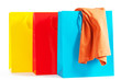 drei bunte einkaufstüten mit shirt auf weissem hintergrund