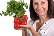 Woman holding tomatoes