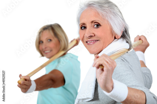 Photo: portrait of two women doing exercise portrait of two women doing exercise