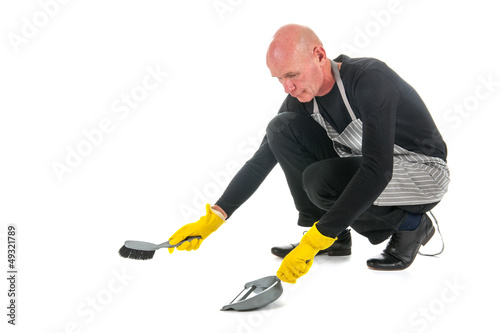 Photo: Houseman with dustpan and brush Houseman with dustpan and brush
