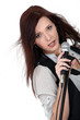 Sultry brunette singing into microphone