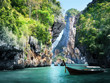long boat and rocks on railay beach in Krabi, Thailand
