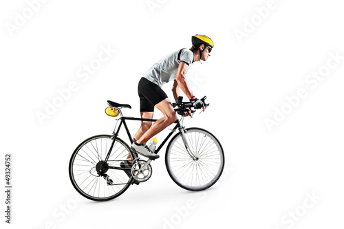 Photo: Male bicyclist riding a bike Male bicyclist riding a bike