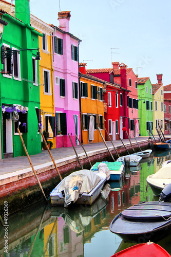 Colorful houses along a canal in Burano, near Venice, Italy