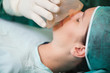 Nurse putting an oxygen mask on a patient