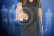 Businesswoman pressing on touchscreen