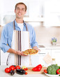 Foto: Young Man Cooking Pizza Young Man Cooking Pizza